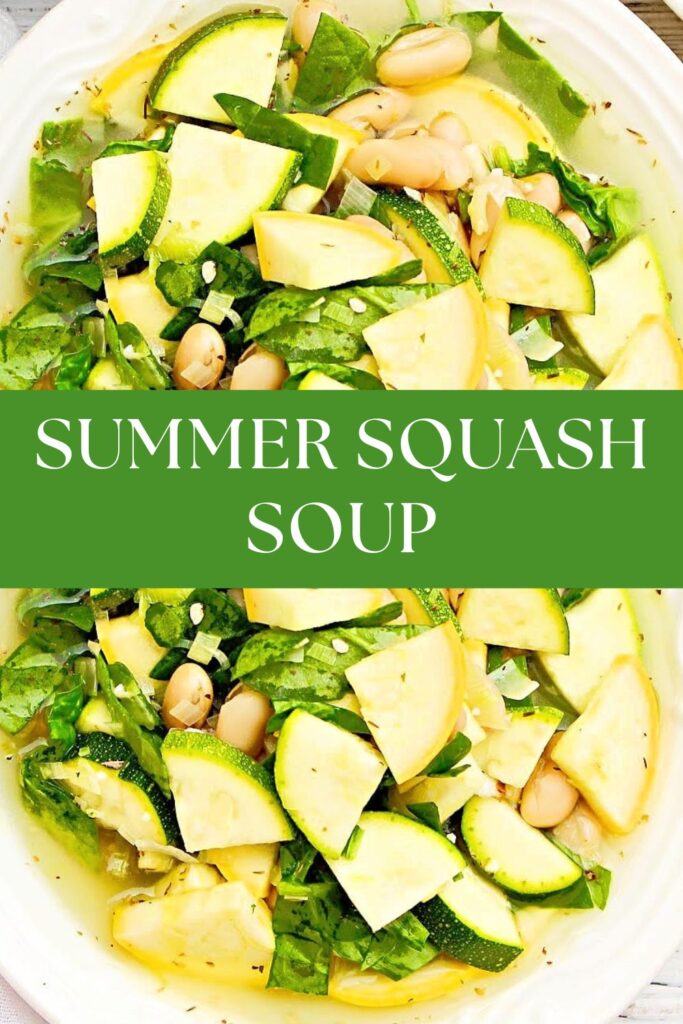 Soup with yellow squash, zucchini, white beans, and spinach in a white serving bowl. 